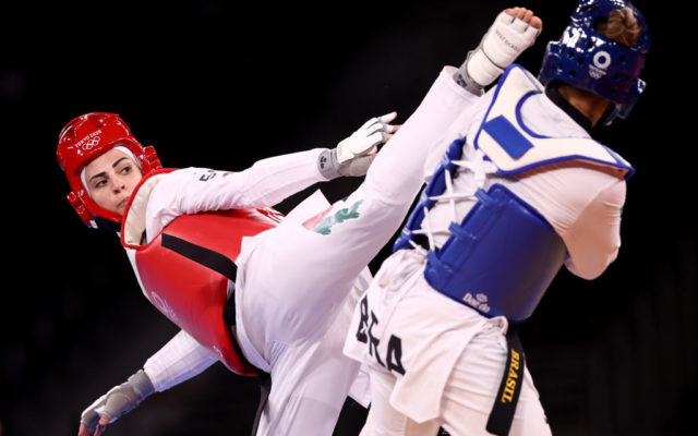 Julyana Al-Sadeq of Team Jordan (L) competes against Milena Titoneli of Team Brazil during the Women's -67kg Taekwondo Round of 16 contest on day three of the Tokyo 2020 Olympic Games at Makuhari Messe Hall on July 26, 2021 in Chiba, Japan.